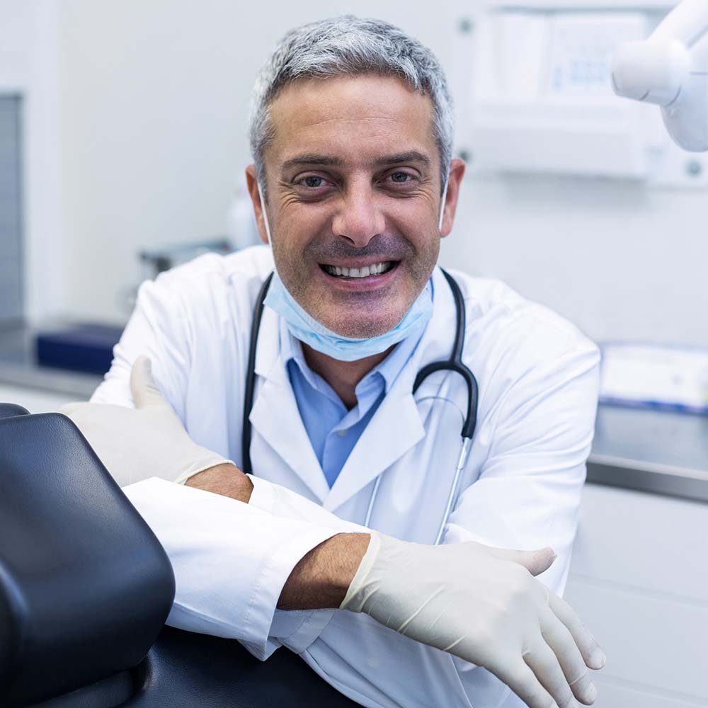 portrait-of-a-smiling-dentist-ALK7GVH.jpg